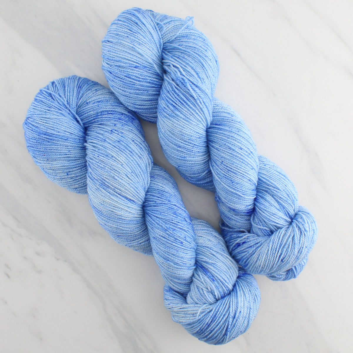 ALPINE BLUE Hand Dyed on Feather Fingering - Semi-Solid Colorway with Speckles