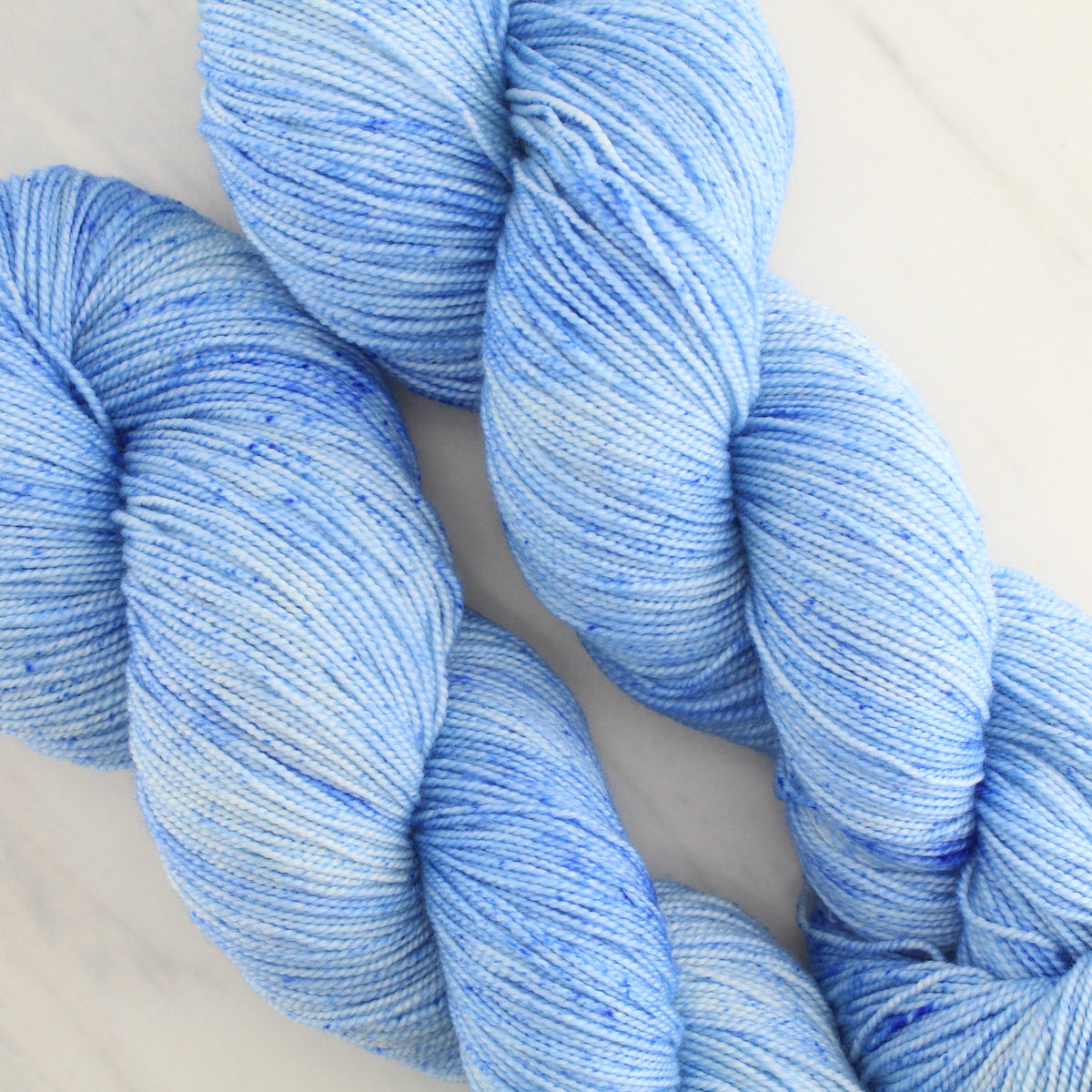 ALPINE BLUE Hand Dyed on Feather Fingering - Semi-Solid Colorway with Speckles