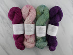 AS YOU WISH by Mary Annarella of Lyrical Knits - CURATED YARN SET #3 with Burgundy Rose, Rosy-Fingered Dawn, Eggplant, and Sage on Sparkly Merino Sock