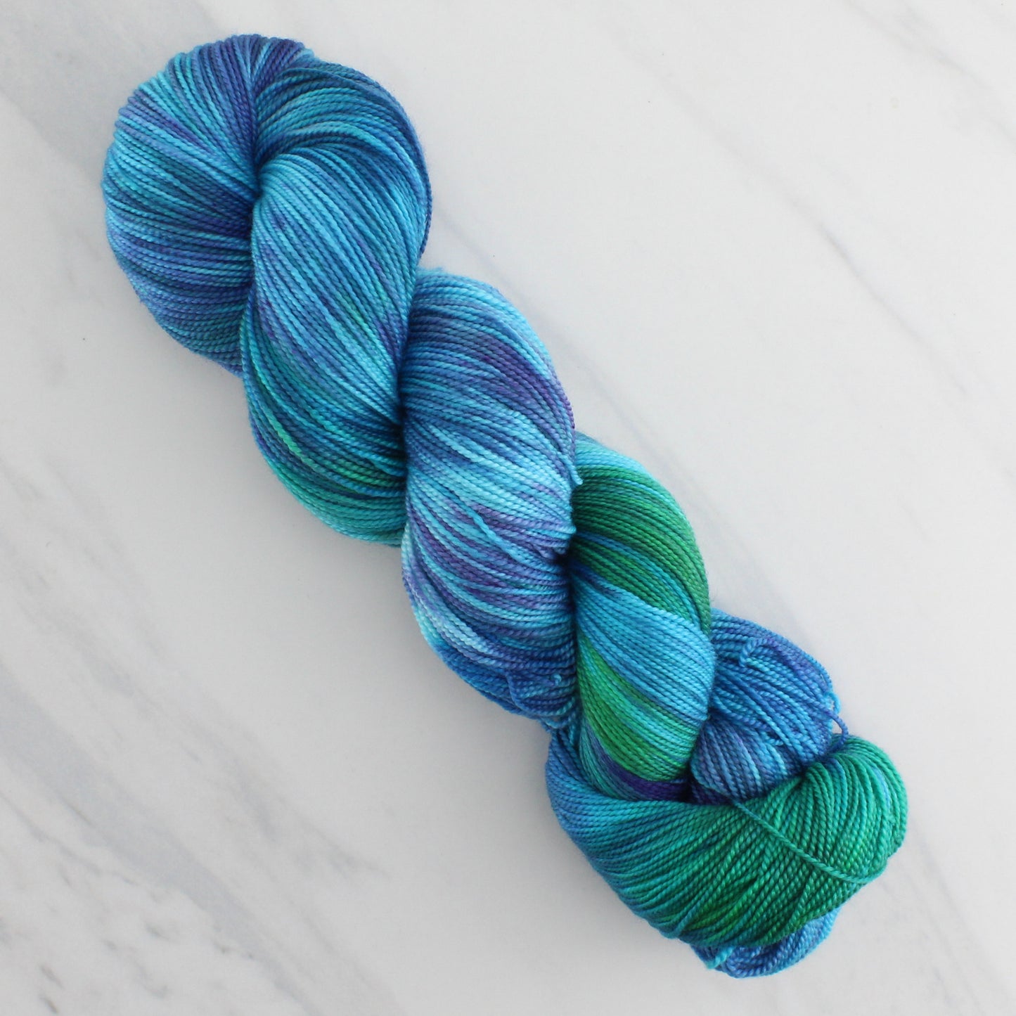 DREAMS OF THE SEA Hand Dyed on Feather Fingering - Splashed & Speckled Yarn