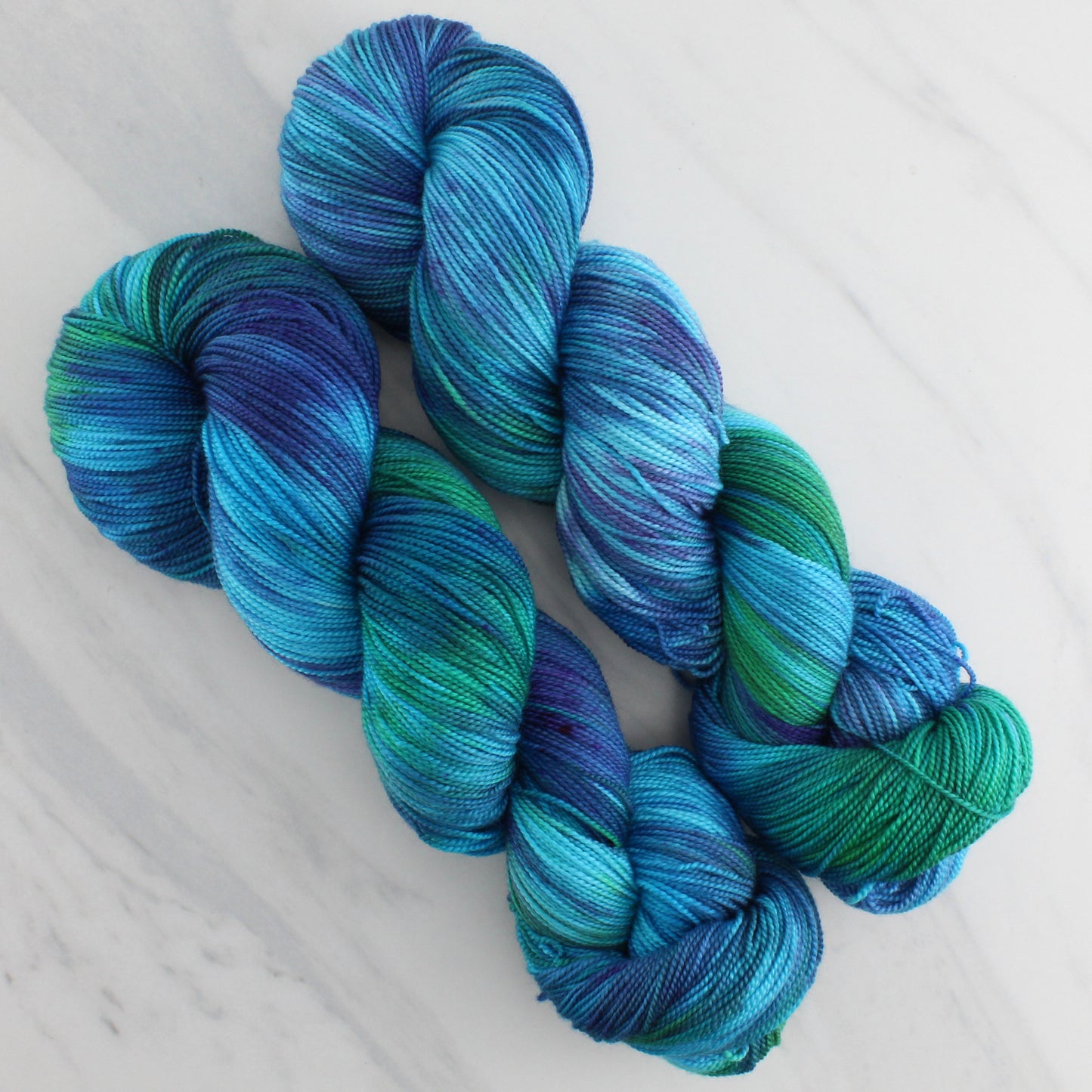 DREAMS OF THE SEA Hand Dyed on Feather Fingering - Splashed & Speckled Yarn