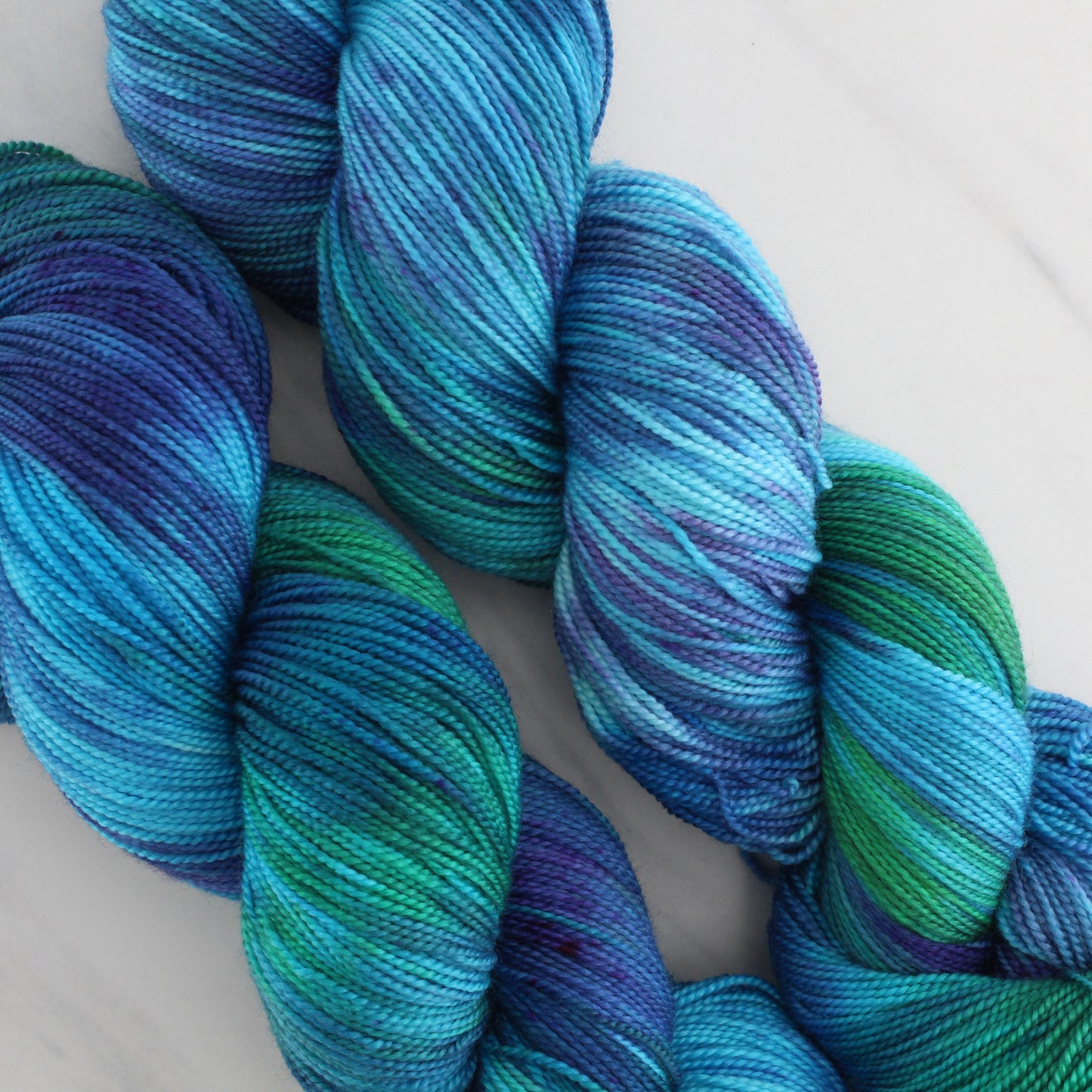 DREAMS OF THE SEA Hand Dyed on Feather Fingering - Splashed & Speckled Yarn