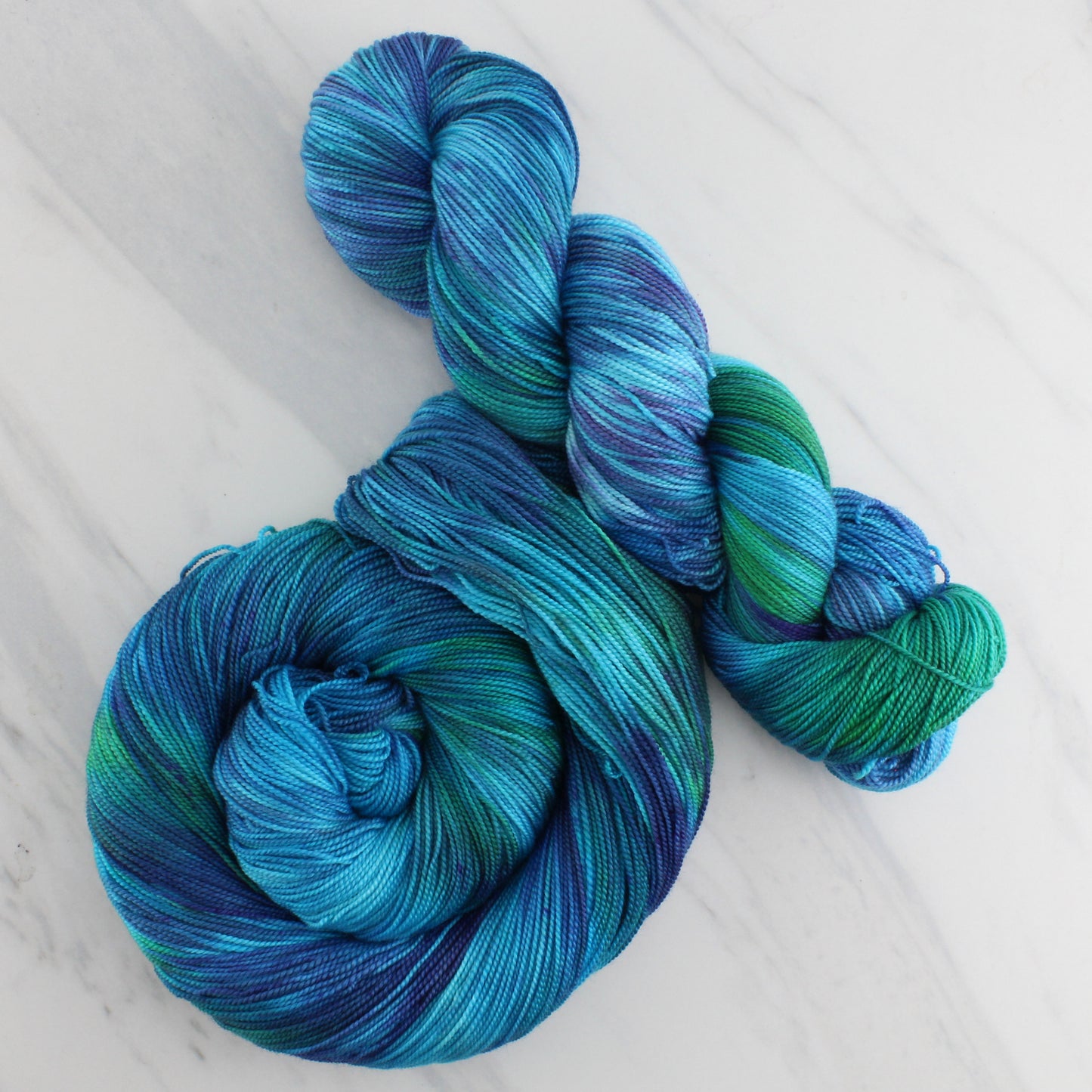DREAMS OF THE SEA Hand Dyed on Feather Fingering - Splashed & Speckled Yarn