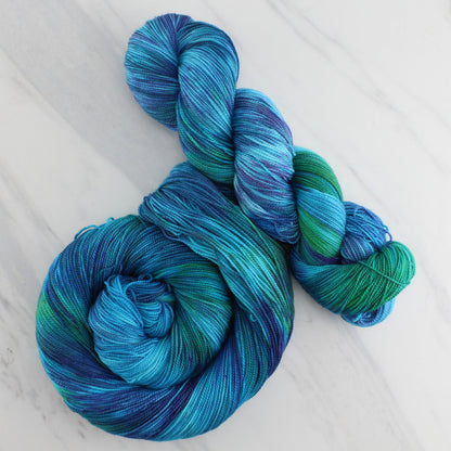 DREAMS OF THE SEA Hand Dyed on Feather Fingering - Splashed & Speckled Yarn