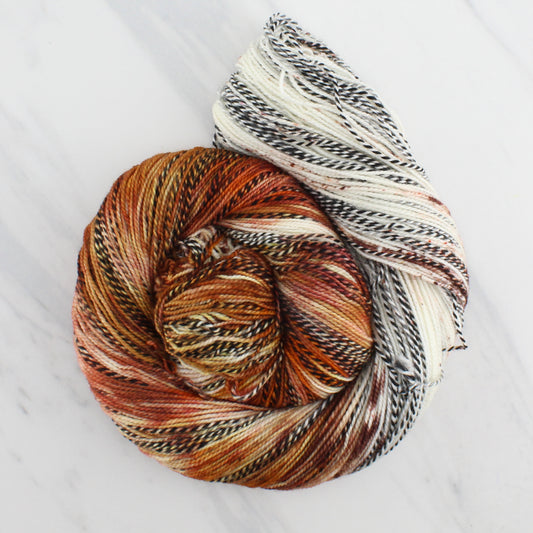 PUMPKIN SPICE LATTE on Stained Glass Fingering - Assigned Pooling Colorway